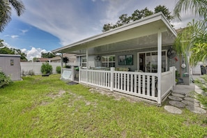 A residential property with a covered porch, a fenced yard, and a small shed. - Families w/ Pets! Home 10 Mi to Busch Gardens (Tampa)