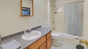 A bathroom with a sink, toilet, and shower. - 21 Acres, Near Trails to Shore with Island Access (Lubec)