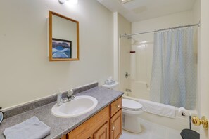 A bathroom with a sink, toilet, and shower. - 21 Acres, Near Trails to Shore with Island Access (Lubec)