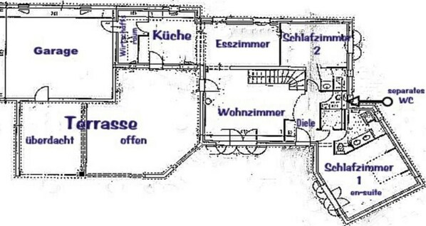 A floor plan with a garage, kitchen, living room, two bedrooms, and a terrace.
