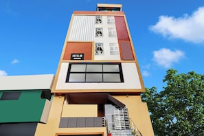 A multi-story building with a sign reading 'HOTEL' on the facade. - Super Hotel O Vizianagaram (Vizianagaram)
