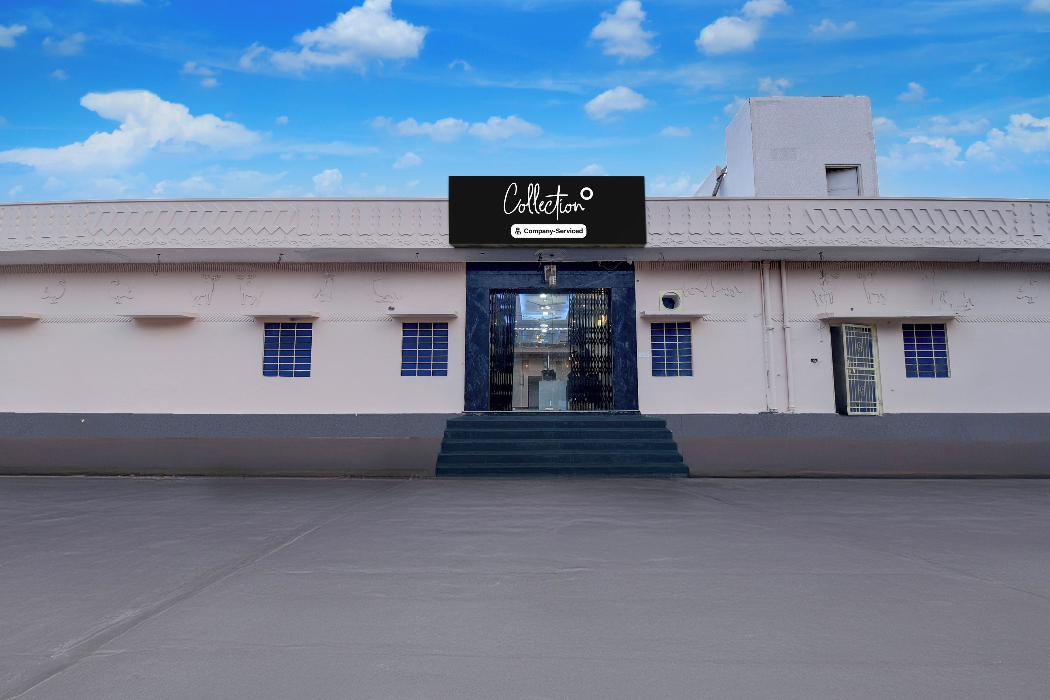 A building with a sign reading 'Collection Company-Serviced' above the entrance.