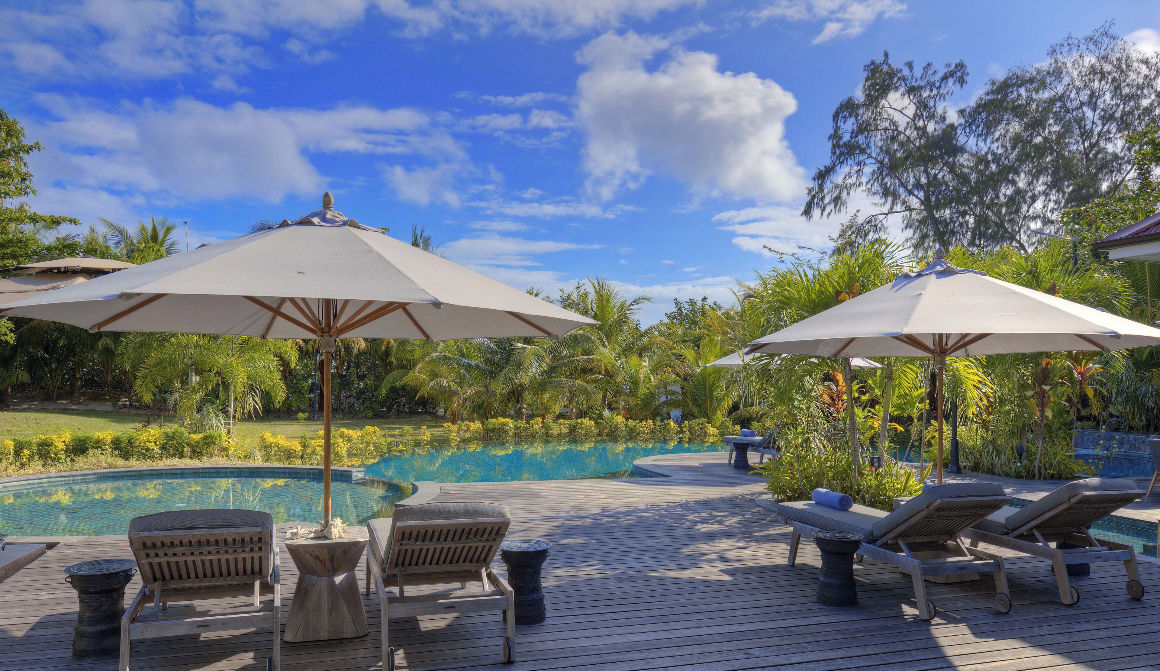 Outdoor pool, open 7:00 AM to 7:00 PM, pool umbrellas, sun loungers