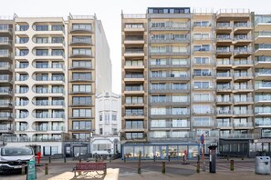 A multi-story residential building with balconies and a central courtyard. - Apartment in Zeedijk With Stunning Sea Views (Blankenberge)