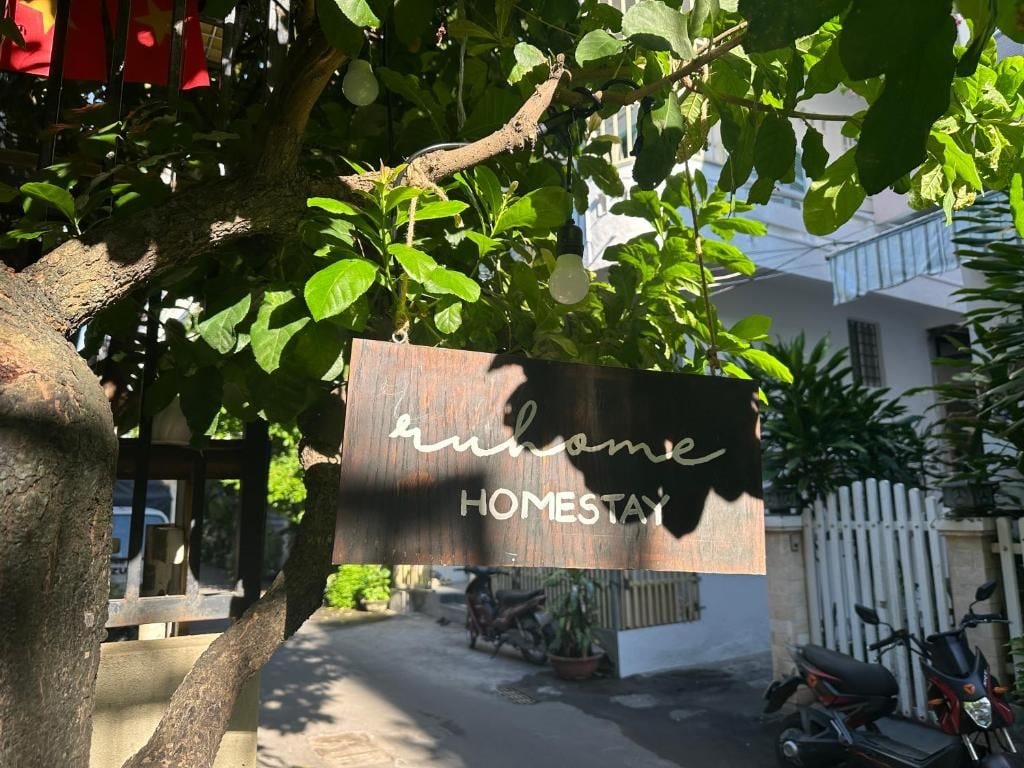 A sign with the text 'home' and 'HOMESTAY' indicating a homestay accommodation.