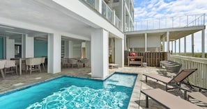 A pool area with a hot tub, outdoor seating, and a barbecue grill. - Ocean-view Home 7BR Retreat (Panama City Beach)