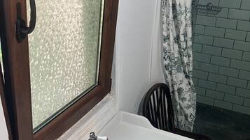 Shower, towels, soap, toilet paper
