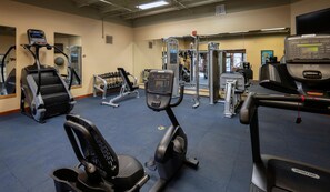 A gym with various exercise equipment including treadmills, elliptical machines, and weight machines. - Beaver Run|Ski In/Out|Cozy Chalet|Pool & Hot Tub (Breckenridge)