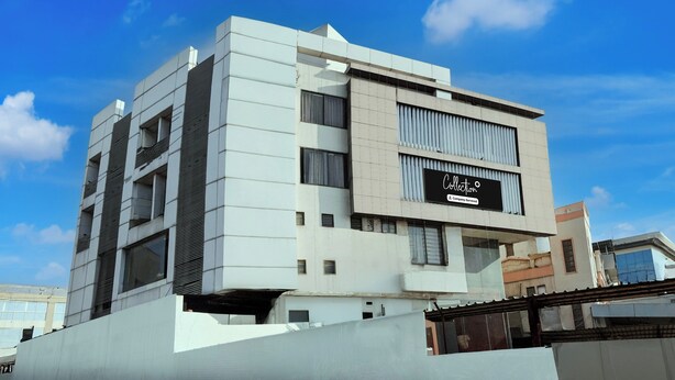 A modern building with a sign that reads 'Collecton & Company Serviced'. - Collection O Motipura Bus Terminal (Himatnagar)
