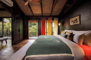 A room with a bed, a bench, a door, and a view of greenery outside. - Lamia Tropical Garden (Tay Hoa Lu)