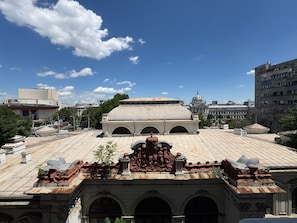 A large building with a dome and a courtyard with a fountain. - The Spacious next to University Square View and Old Town (Bucharest)