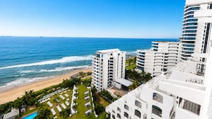 A beachfront hotel with multiple white buildings, a pool, and a view of the ocean. - Cabana Beach by First Private Stays (uMhlanga)