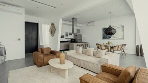 A modern living room with a sofa set, a coffee table, and a dining area with chairs. - Exclusive 3-Bed Villa in Amphoe Ko Samui, Sleeps 6, 1020 (Chang Wat Surat Thani)