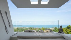 A balcony with a view of the sea and a Buddha statue. - Idyllic 4-Bed Villa in Amphoe Ko Samui, Sleeps 8, 1019 (Chang Wat Surat Thani)