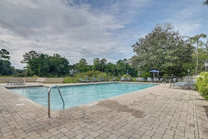 A rectangular pool with a tiled edge, surrounded by a brick patio. - 1 Mi to Beach! Golfers Paradise on Pawleys Island (Pawleys Island)