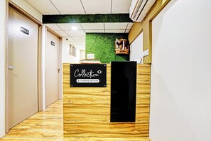 A reception desk with a sign that reads 'Collection Company-Serviced'.