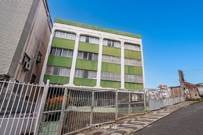 A multi-story building with barred windows and a gated entrance. - Charming Apt w/ Air Conditioning in Pituba Gaa0103 (Salvador)