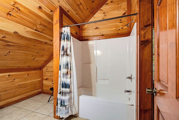 Private bathroom with a tub and shower combination - New Listing, Hot Tub, Private Indoor Heated Pool, Theater Room (Pigeon Forge)