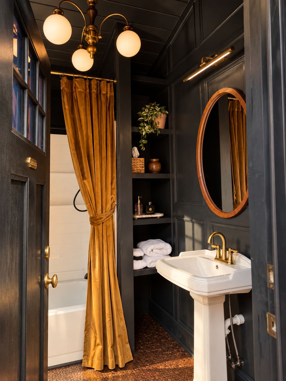 A bathroom with a white sink, a mirror, and a shower curtain.