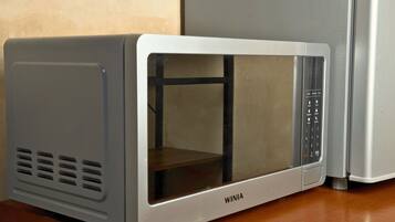 A microwave oven with a digital control panel and a transparent door.
