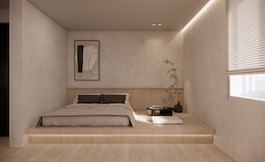 A minimalist bedroom with a bed, a bedside table, a wall-mounted artwork, and a window with blinds. - Hotel COTA (Busan)