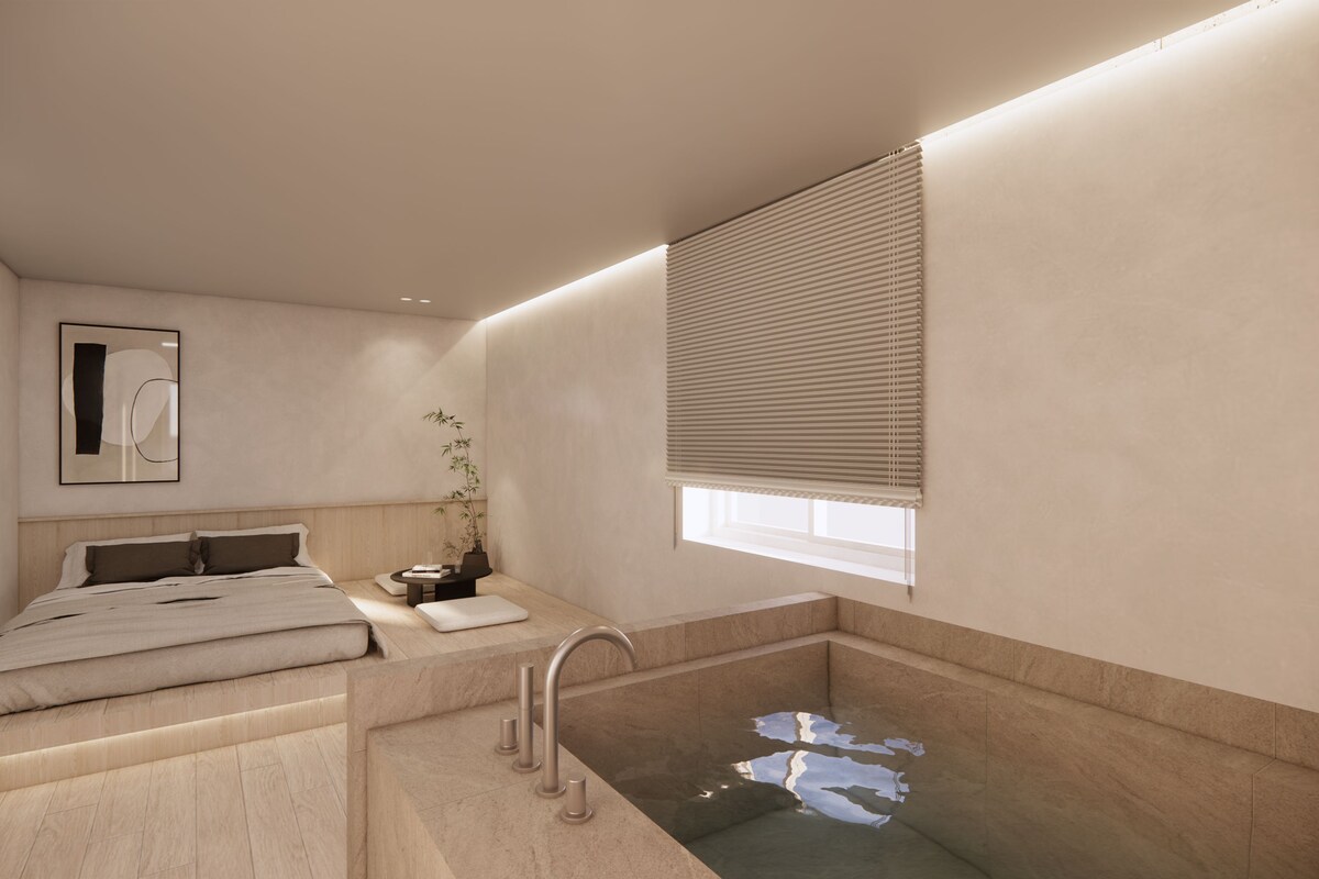 Un baño moderno con bañera, inodoro y lavabo.