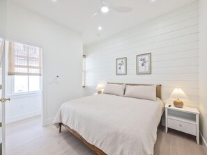 Bright and inviting bedroom with warm natural light and chic furnishings for a welcoming atmosphere. - Modern Condo Above Boutiques + Beach Nearby (Cape May)