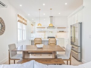 Bright and inviting kitchen and dining area designed for comfort and contemporary living. - Modern Condo Above Boutiques + Beach Nearby (Cape May)