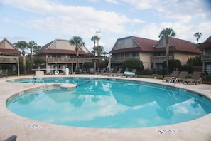 A swimming pool with lounge chairs and palm trees. - Ocean View, Golf Cart Included, Pet Friendly, Walk to the Beach - 406 Captain John Fripp Villa (Fripp Island)