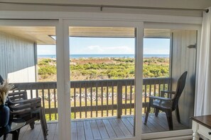 A balcony with a view of the beach and dunes. - Ocean View, Golf Cart Included, Pet Friendly, Walk to the Beach - 406 Captain John Fripp Villa (Fripp Island)