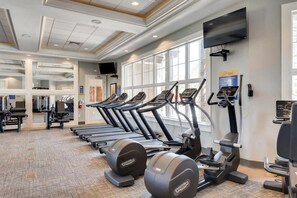 A gym with treadmills, elliptical machines, and weight equipment. - Poolside Paradise!

Poolside Paradise! (Davenport)