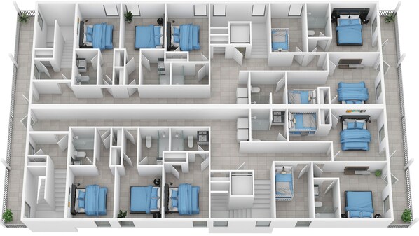 Et hotelplan med flere værelser, badeværelser og et køkken.