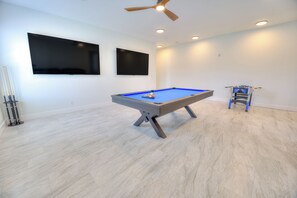 A room with a pool table, ceiling fan, recessed lighting, and a foosball table. - BRAND NEW ACROSS FROM OCEAN 12 beds/10 baths • Pvt Pool and Spa • Sleeps 28 (North Myrtle Beach)