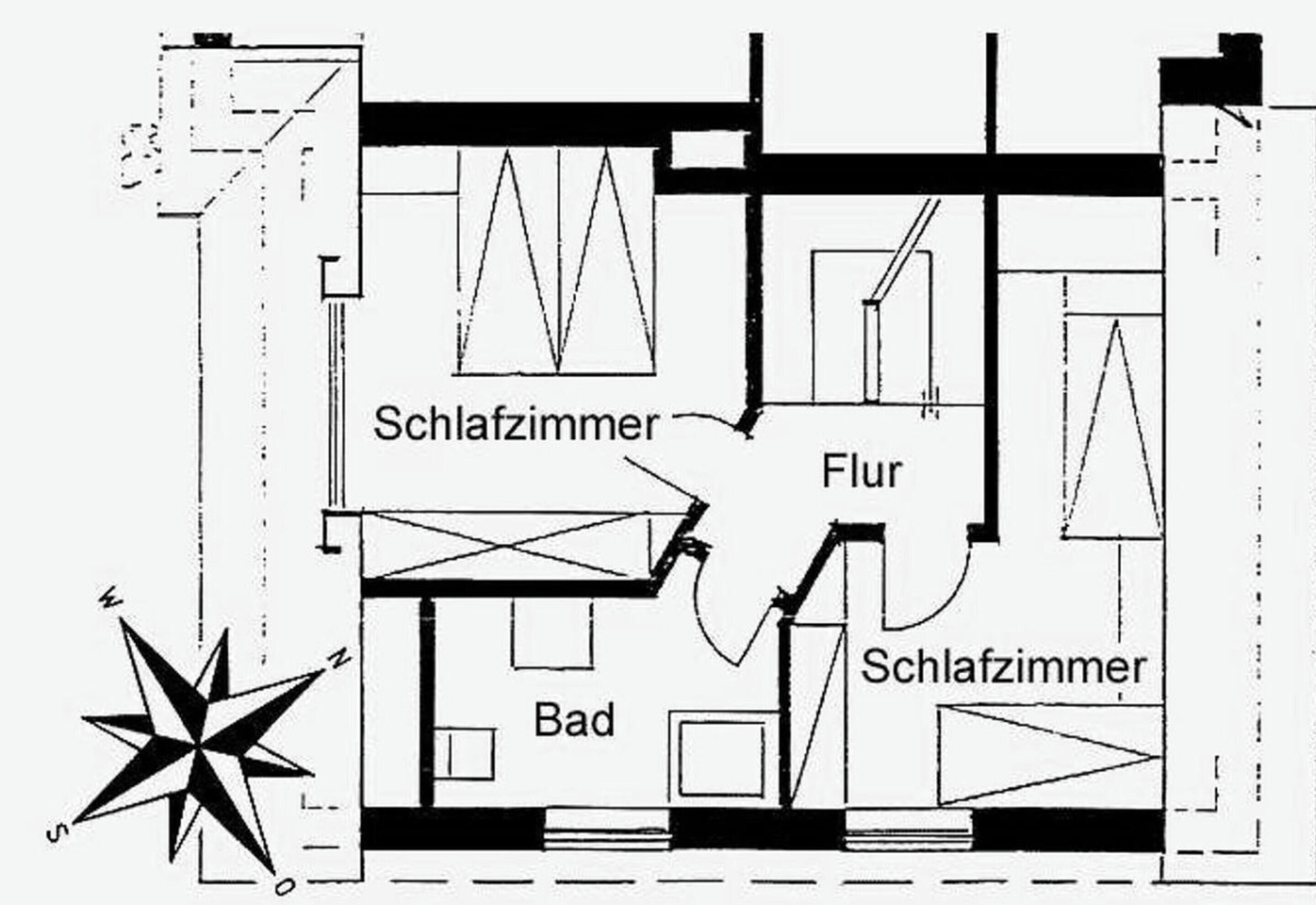 A floor plan with two bedrooms, a bathroom, and a living area.