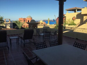 Outdoor dining - Poolside with Island Views and steps to Beach (Nopolo)