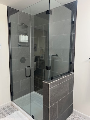 A glass-enclosed shower area with a tiled floor and a glass partition. - Cozy 3-bed mtn condo in village, walkable to all! (Slaty Fork)