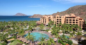 A resort with multiple buildings, a central pool area, and palm trees. - One bedroom suite at Villa Del Palma at the Islands of Loreto (Baja California Sur)