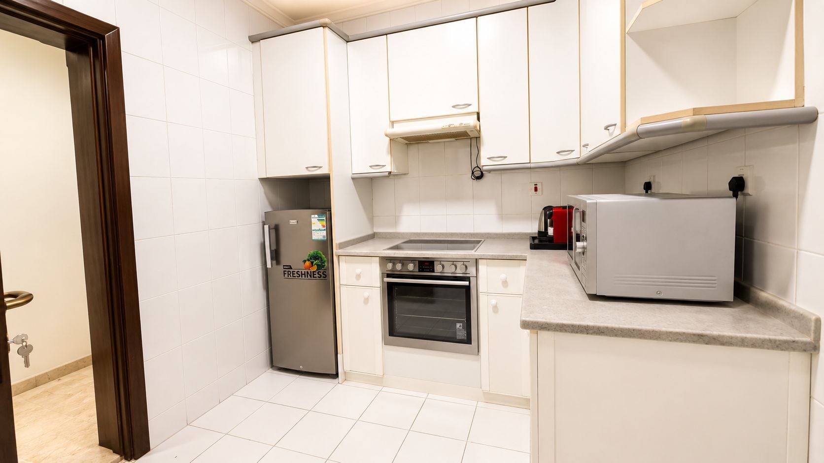 Apartment, City View | Private kitchen | Full-size fridge, microwave, oven, stovetop