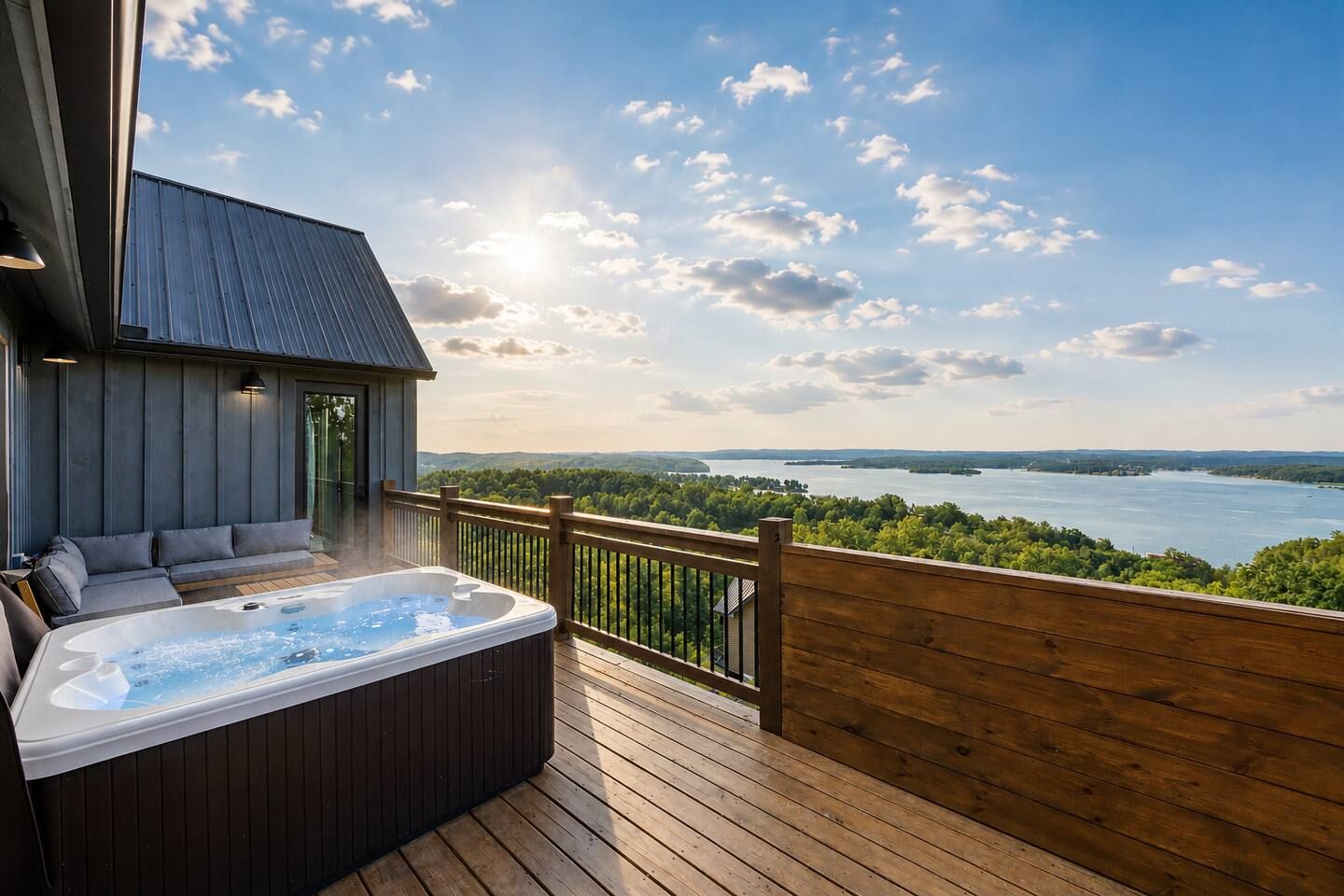 A hot tub on a wooden deck with a view of a lake and forest.