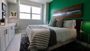 A bedroom with a bed, a desk, and a window. - Renovated 21st Fl. Private Unit Located in Coconut Grove Hotel! (Miami)