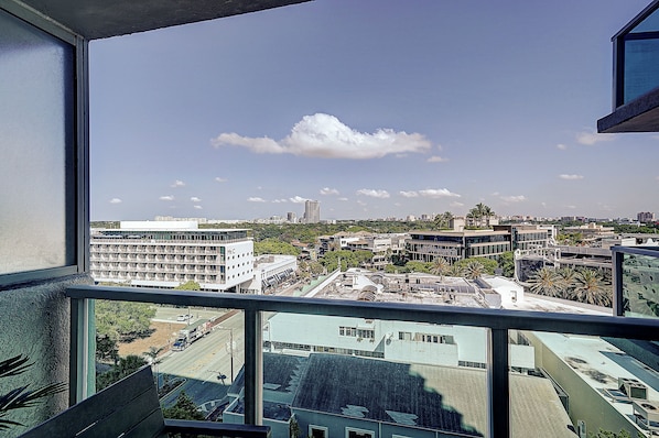A cityscape viewed from a high-rise building with a clear sky. - Coconut Grove 1/1 Condo Parking Included (Miami)