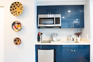 A modern kitchen with a microwave, coffee maker, and a sink. - Deluxe Studio in Coconut Grove-city & Bay Views...includes Parking (Miami)