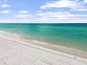 A beach with clear turquoise water and a sandy shore. - Editorial Townhome on Quiet Beach • 3mi to 30A (Panama City Beach)