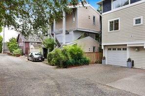 A residential area with houses, a car, and a driveway. - Private, stylish townhouse in Prime Capitol Hill, Seattle location (Seattle)
