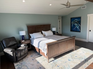 A bedroom with a bed, a chair, a nightstand, a lamp, and a painting on the wall. - Santa Ynez Valley Wine Country Ranch & 360 views! (Santa Ynez)