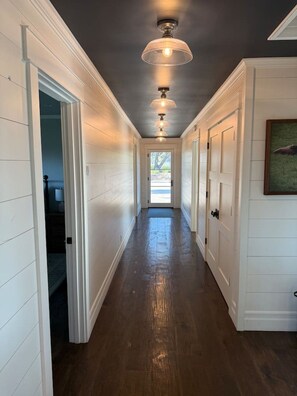 A hallway with white paneling, a wooden floor, and a ceiling with recessed lighting. - Santa Ynez Valley Wine Country Ranch & 360 views! (Santa Ynez)