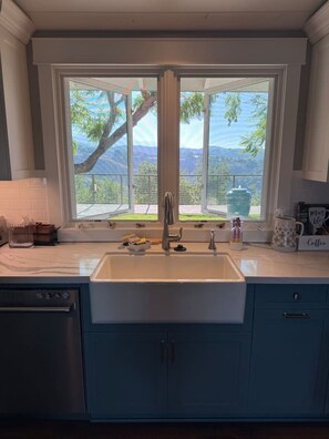 A kitchen with a large window, a sink, and cabinets. - Santa Ynez Valley Wine Country Ranch & 360 views! (Santa Ynez)