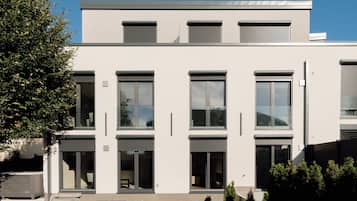 A modern building with multiple windows and a flat roof.