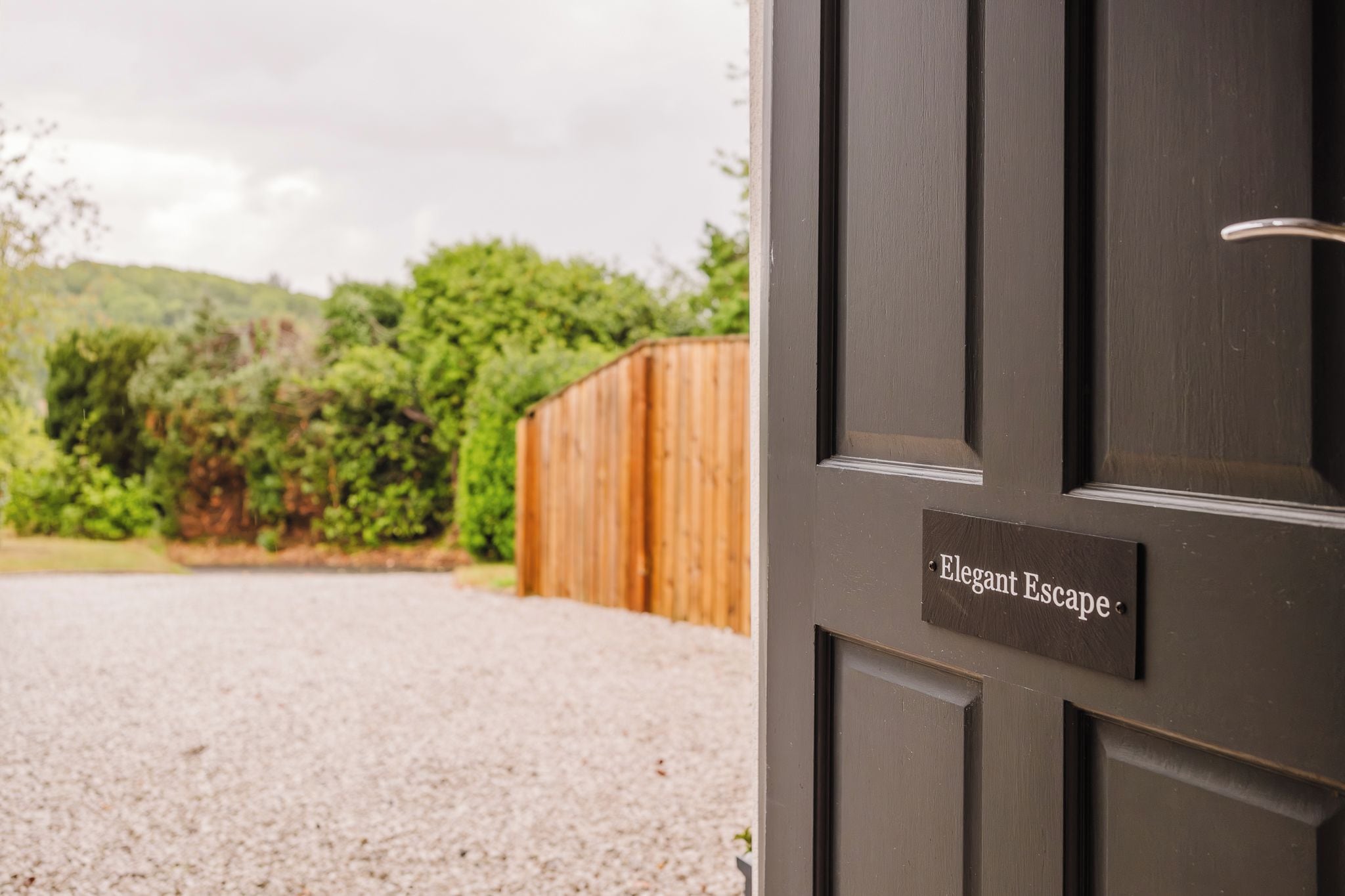 A door with a sign that reads 'Elegant Escape.'