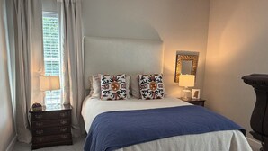 A bedroom with a bed, a dresser, a nightstand, a lamp, and a mirror. - "Rebel Depot" - By OVR (Oxford)